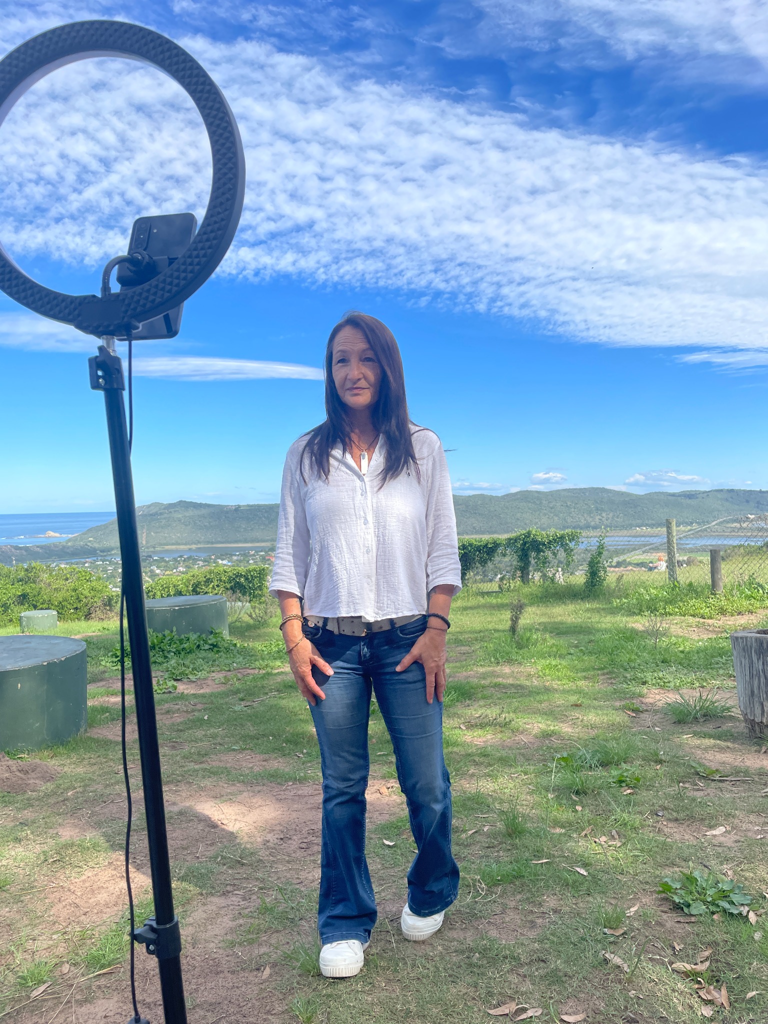 Tracey under a bright coastal sky